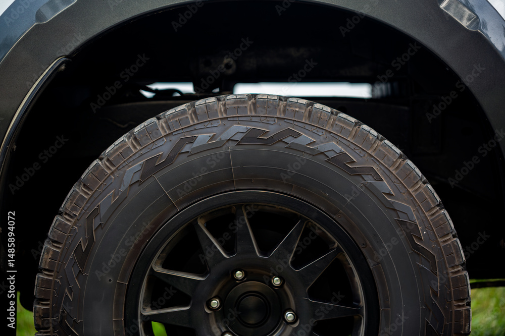 Off-road tires,Mud dirty pickup truck wheel,Close up off tire track 4x4 off raod car in dark concept Off-road tires,Mud dirty pickup truck wheel,Close up off tire track 4x4 off raod car in dark concept