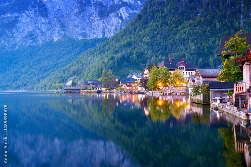 Fototapeta premium Dawn Light Hallstatt Lake Austria. Early morning light and reflections on historic Hallstatt Lake in Austria.