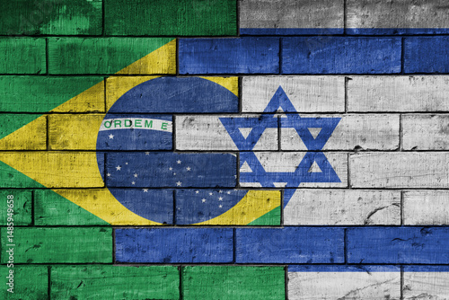 colourful painted big national flag of israel and flag of brazil on a massive old brick wall background. concept