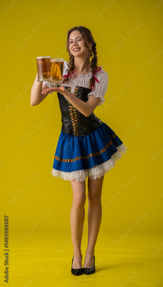 Young Woman in Traditional Costume Holding Beer Mugs Young Woman in Traditional Costume Holding Beer Mugs