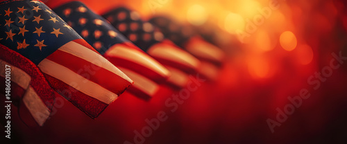 Close-up of American flags, bathed in warm, golden light. A patriotic image perfect for celebrating national holidays.