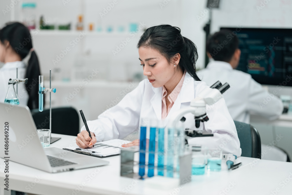 Medical research team conducting scientific experiments in a pharmaceutical laboratory, analyzing samples under microscopes to develop innovative medicine and healthcare solutions Medical research team conducting scientific experiments in a pharmaceutical laboratory, analyzing samples under microscopes to develop innovative medicine and healthcare solutions