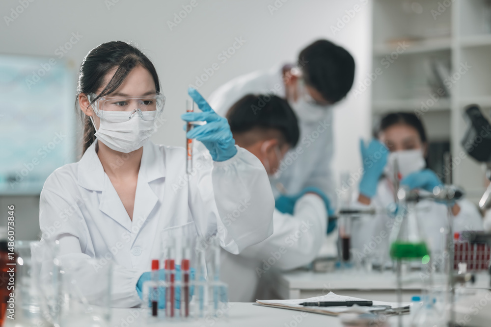 Fototapeta premium Research team working in medical science laboratory to develop innovative cosmetic products through precise analysis experimentation, technology with collaborative scientific methods