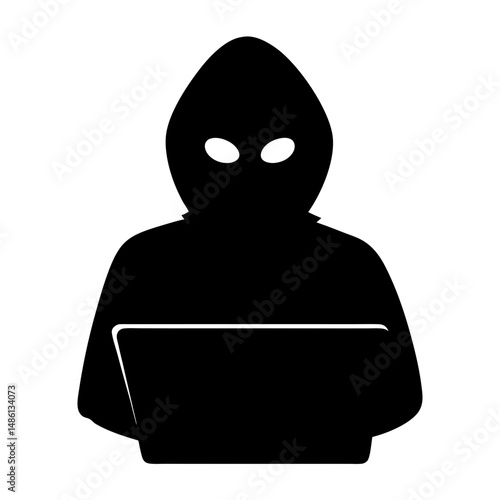 Silhouette of a hooded figure using a laptop with unknown intentions