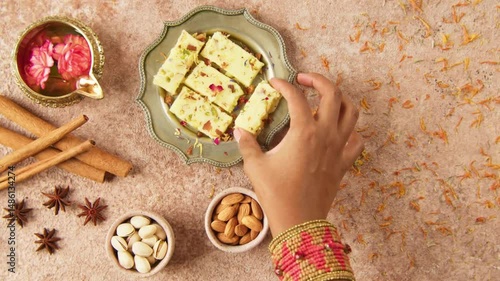 Traditional Indian Diwali Sweets Displayed on Festive Table in 4K – Celebratory Deepavali Treats with Lamps and Colorful Decor