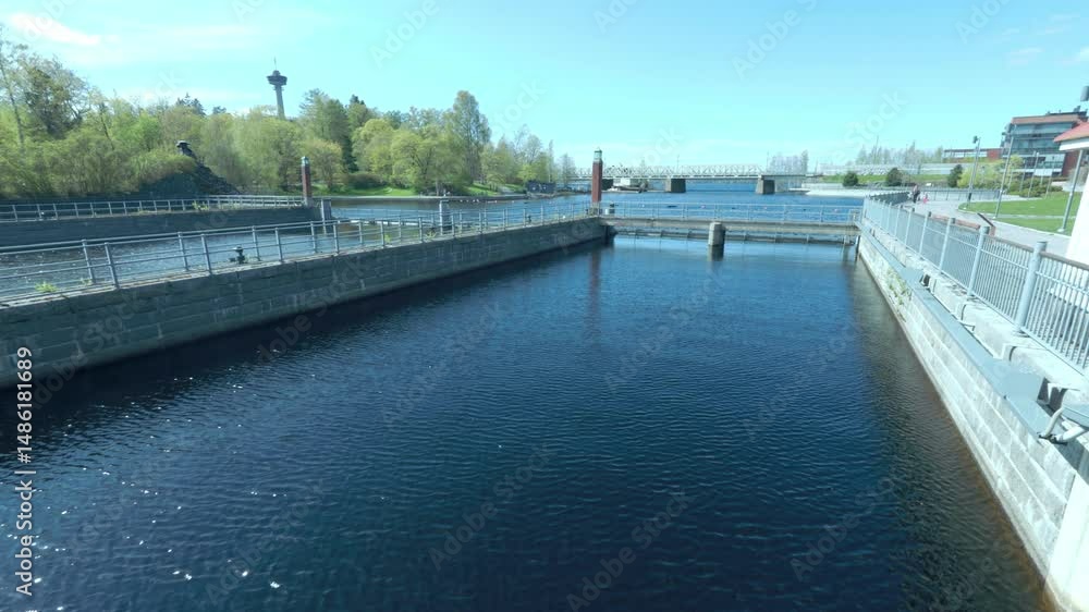 Water Canal in Tampere with distant view of Näsinneula Tower Water Canal in Tampere with distant view of Näsinneula Tower