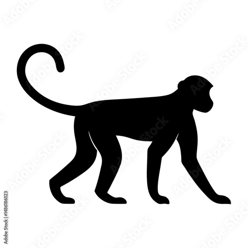 Silhouette of a monkey in a walking pose with a curved tail