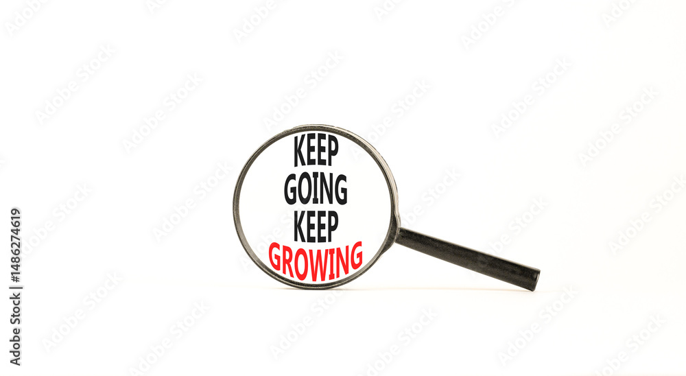 Keep going and growing symbol. Concept words phrase Keep going keep growing in beautiful black magnifying glass. Beautiful white background. Business Keep going and growing concept. Copy space. Keep going and growing symbol. Concept words phrase Keep going keep growing in beautiful black magnifying glass. Beautiful white background. Business Keep going and growing concept. Copy space.