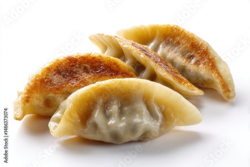 A plate of delicious gyoza dumplings, isolated on a clean white background