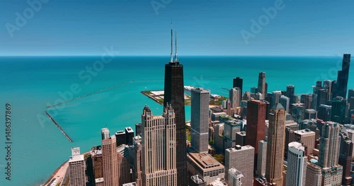 Stunning skyscrapers on the lakefront of Michigan Lake. Tower of John Hancock Center approached from drone.
