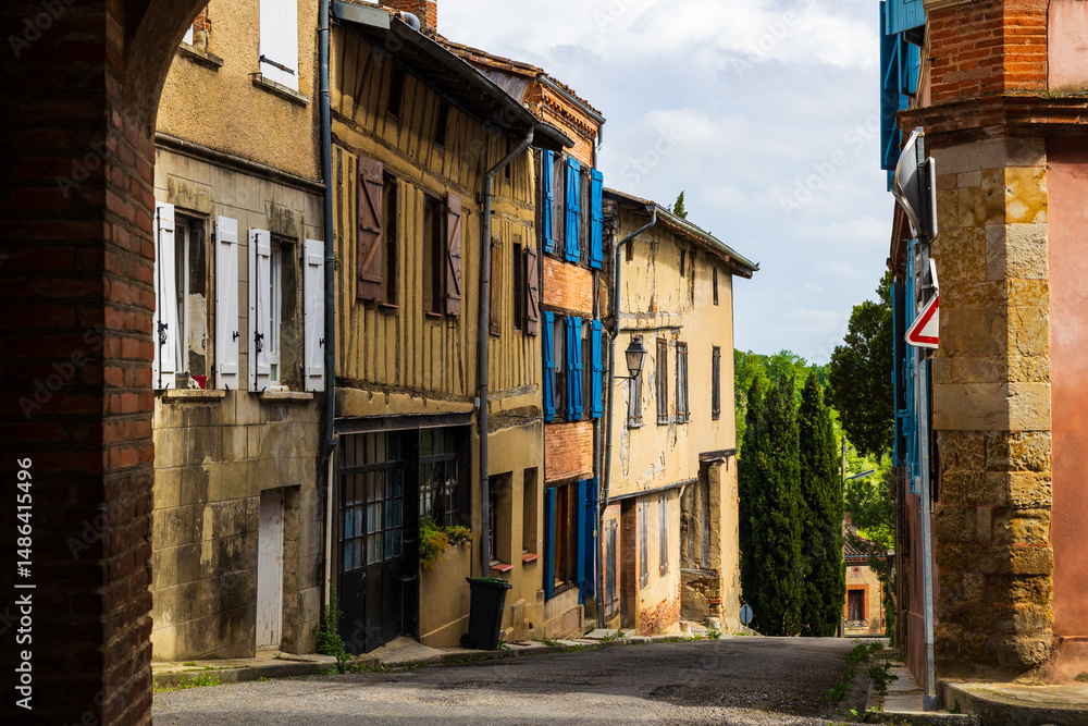Fototapeta premium Old brick facade in the village of Saint-Ybars, in the Terrefort region of Ariège