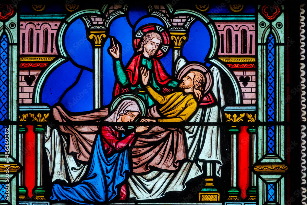 Stained glass (19th century) of Death of Saint Joseph surrounded by Mary and Jesus. Stained glass (19th century) of Death of Saint Joseph surrounded by Mary and Jesus.