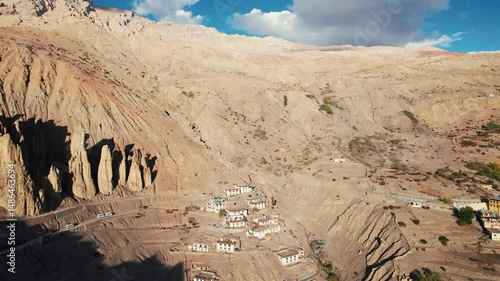 4K Aerial view of Dhankar village in Spiti Valley, Himachal Pradesh, India. Unique natural rock formation in mountains. Cold desert of India. Summer travel destination. Mountain landscape.