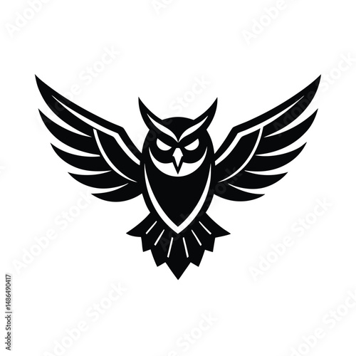 Majestic owl soaring wings spread black silhouette