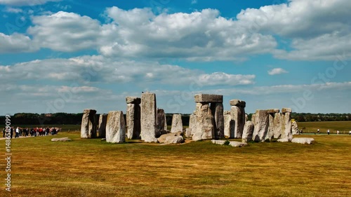 Stonehenge establishing shot capturing a full panorama of the outer stone circle against the expansive sky, Salisbury, Wiltshire, England, UK