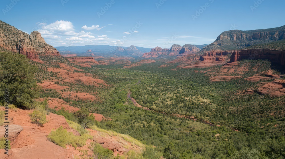 Fototapeta premium A Serene Canyon With Red Rock Cliffs And A River Winding Through The Lush Green Valley