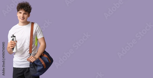 Sporty young man with bottl...