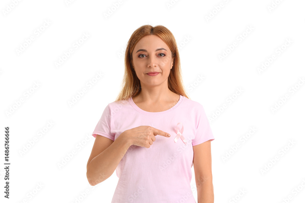 Mature woman pointing at awareness pink ribbon on white background. Breast cancer concept Mature woman pointing at awareness pink ribbon on white background. Breast cancer concept