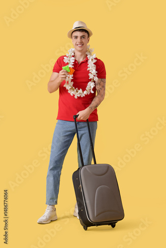 Young man with suitcase and...