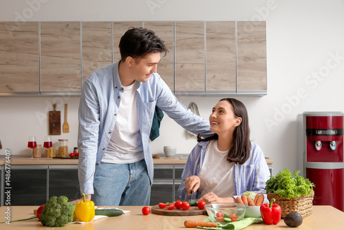 Happy young couple preparin...
