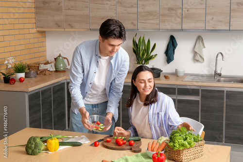 Happy young couple cooking ...