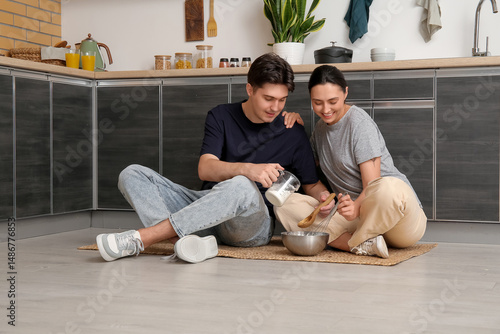Young couple preparing past...