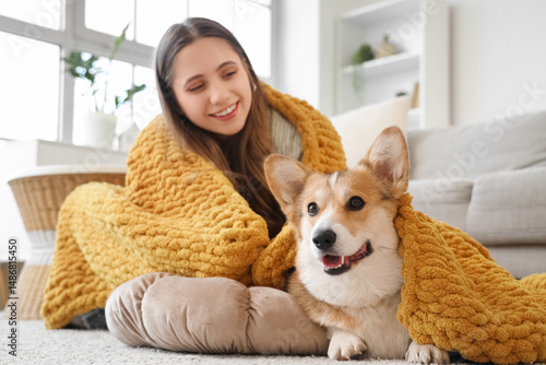 Young woman and Corgi dog w...