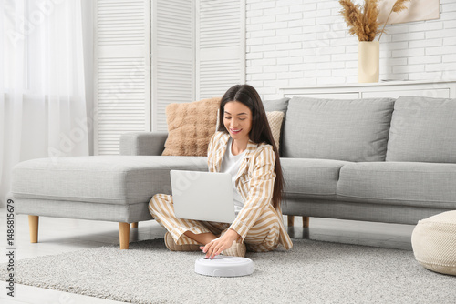 Young woman in pajamas with...