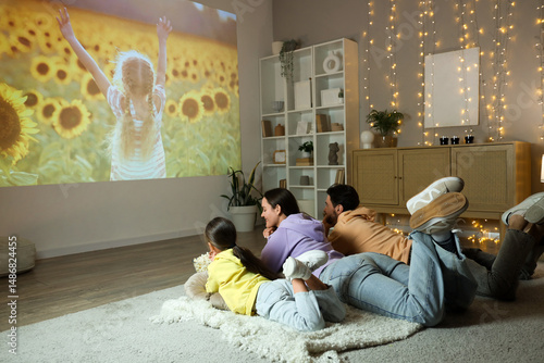 Family watching movie toget...