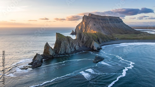 Aerial View of Dramatic Coastal Cliffs in Iceland During Golden Hour Light