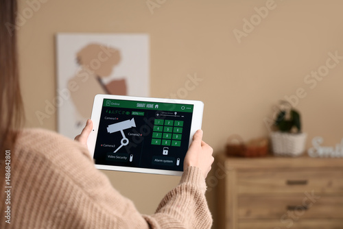 Woman holding smart home se...