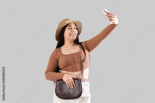 Young woman in hat with mob...