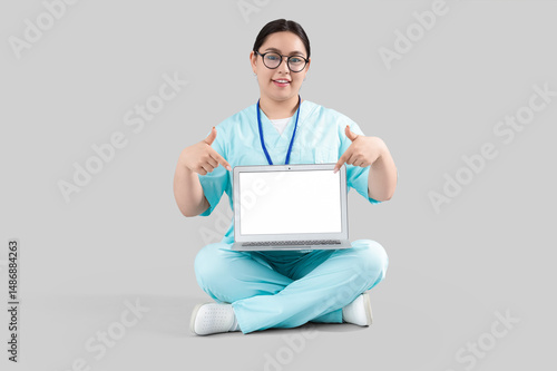 Female doctor pointing at b...