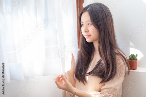 Portrait of smiling beautiful sexy long hair women in cozy room Free Download Portrait of smiling beautiful sexy long hair women in cozy room - GFXLoad