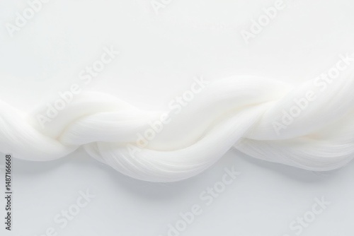 Close-up shot of white fiber strands against pure white backdrop, yarn, simple