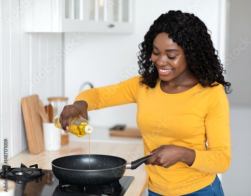 Happy Black Woman Cooking, Pouring Oil in Pan, Kitchen