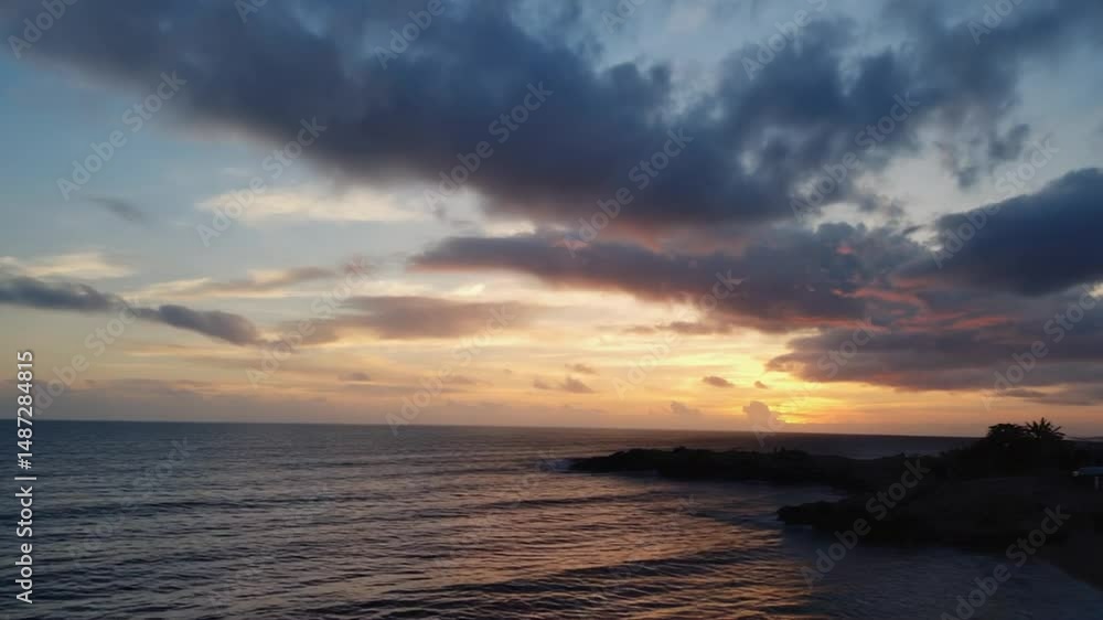 Sunset over the Ocean with Colorful Clouds and Water