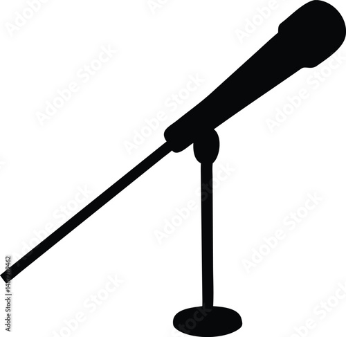 Isolated microphone stands ready, its black form sharply defined against a crisp, white backdrop