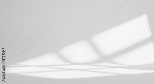 Minimalist white background with window light shadow for product photography or mockup