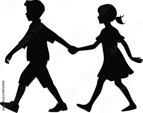 Silhouette of a young boy and girl walking hand in hand side by side