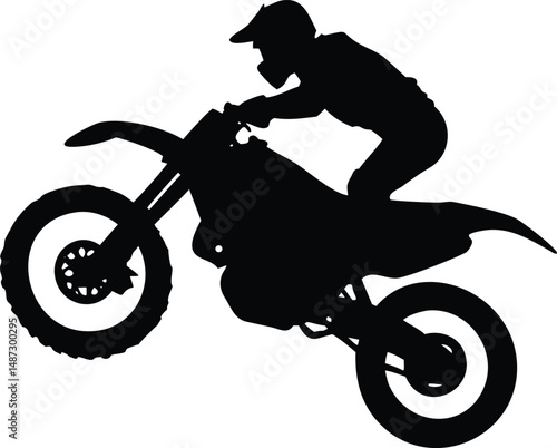 Silhouette reveals a biker intensely maneuvering their motorcycle through challenging jumps and stunts
