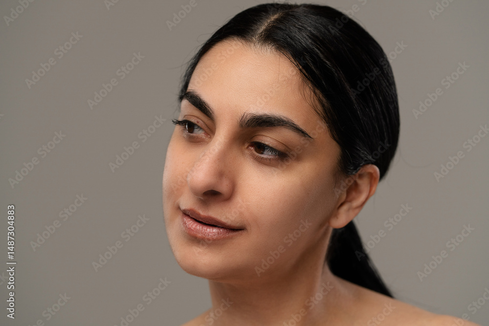 Portrait of a Woman with a Calm and Neutral Expression Portrait of a Woman with a Calm and Neutral Expression