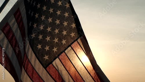 Memorial Day USA. Remember and Honor. Silhouettes of American flag waving on background of beautiful sunset or sunrise for honoring, mourning USA military. Memorial Day, Happy Holiday American Concept