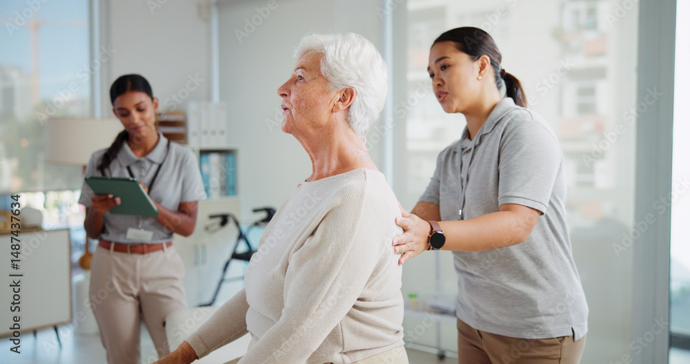Obraz premium Physiotherapy, back pain and woman with mature patient for support, wellness and consultation. Healthcare, chiropractor and physical therapist with person for osteoporosis, mobility and arthritis