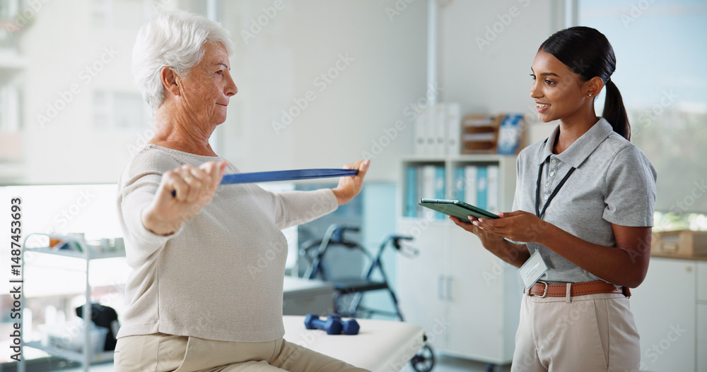 Obraz premium Elderly woman, physiotherapist and resistance band with stretching, smile and healthcare services for recovery. People, happy and exercise with tablet, help and injury for rehabilitation at clinic