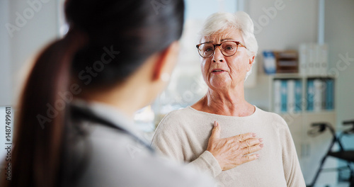 Papier peint Consulting, chest pain and healthcare with old woman and doctor for cardiac rehabilitation, heart arrhythmia or medical