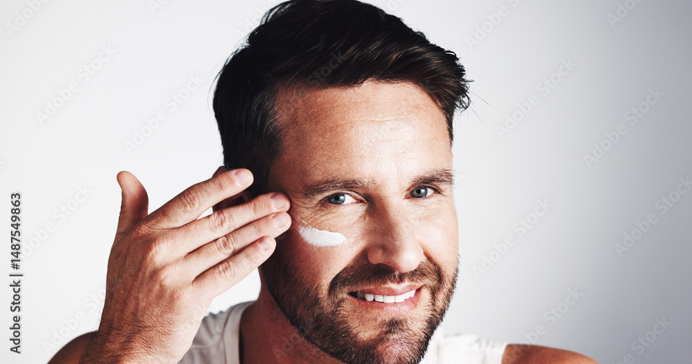 Obraz premium Face cream, portrait and happy man with beauty in studio for anti aging, dermatology space or collagen. Apply, wrinkle treatment or mature person on white background for cosmetics or skincare lotion