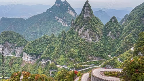 View landscape range mountain and road 99 curve turn for chinese people travelers travel visit Tianmen Shan cave or Heaven Gate in Tianmen Mountain National Forest Park at Zhangjiajie in Hunan China