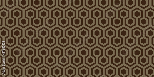 Vintage-style seamless hexagonal geometric pattern in brown and orange tones, ideal for wallpapers, textiles, and retro design themes.
