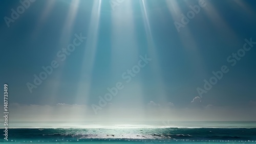 Sun rays pierce through the cloudy sky over the blue sea, creating a beautiful and abstract light on the water's horizon